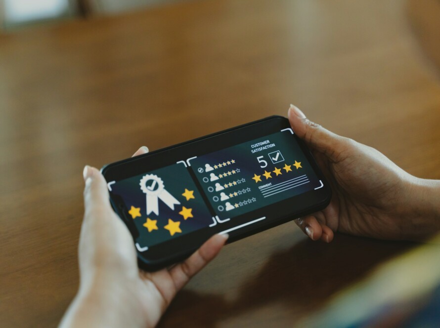 Customer review good rating concept, smile face and five star on screen for positive feedback.